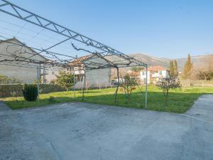 an empty parking lot with a metal structure at Apartments Ivo Bozinovic in Tivat