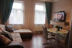 TV a/nebo společenská místnost v ubytování Jurincom apartments na Vyhlidce