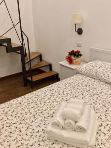 Łóżko lub łóżka w pokoju w obiekcie B&B Sant'Agostino