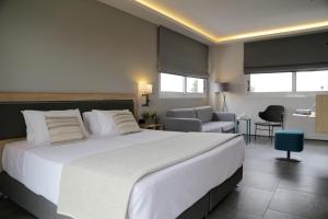 Postel nebo postele na pokoji v ubytování Palmyra Beach Hotel