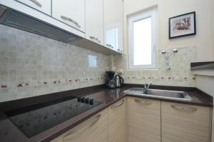 Kuchyň nebo kuchyňský kout v ubytování Apartments Spas
