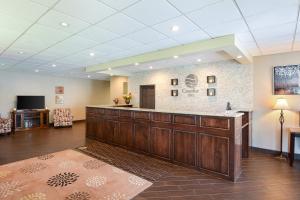 a large lobby with a reception desk in a hospital at Quality Inn in Winchester