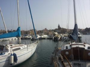 a group of boats docked in a harbor at Da Francesca in Palmadula