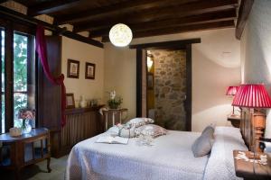 Posteľ alebo postele v izbe v ubytovaní Casa Rural la Casa del Bosque