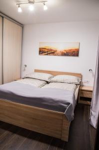 Posteľ alebo postele v izbe v ubytovaní Apartamenty Maria
