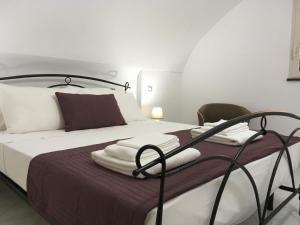 a bedroom with a bed with towels on it at CETARA - ALBERGO DIFFUSO in Cetara +116 photos