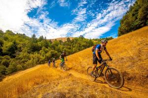 a group of people riding bikes down a dirt road at Hotel Iris Crillon in Fiuggi