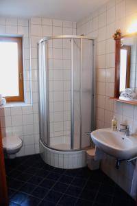 a bathroom with a shower and a sink at Juniorsuite in Turracher Hohe