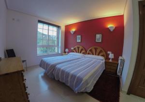 A bed or beds in a room at Olar de Rabacallos