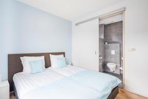 Ένα ή περισσότερα κρεβάτια σε δωμάτιο στο Meliskerke vakantiewoning