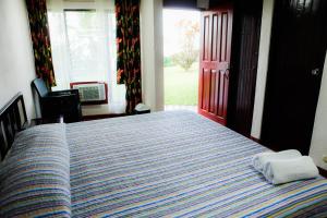 Postel nebo postele na pokoji v ubytování Hotel Maribu Caribe