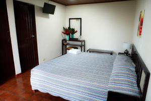 Postel nebo postele na pokoji v ubytování Hotel Maribu Caribe