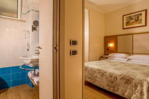 Posteľ alebo postele v izbe v ubytovaní Hotel Piemonte