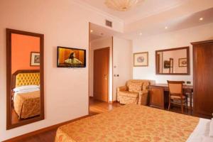 Posteľ alebo postele v izbe v ubytovaní Hotel Piemonte