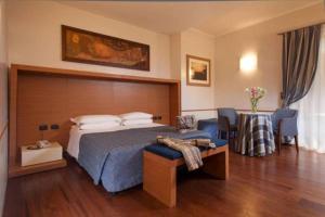 Posteľ alebo postele v izbe v ubytovaní Hotel Piemonte