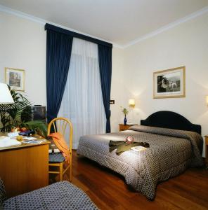Posteľ alebo postele v izbe v ubytovaní Hotel Piemonte