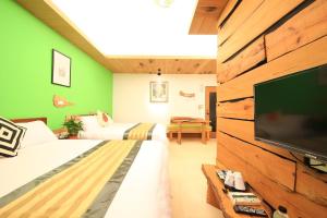 Ліжко або ліжка в номері Yun Xuan Cypress Gardens
