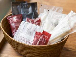 a basket filled with packets of toothpaste at Tsuyukusa-an in Kyoto