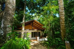 a small house in the middle of a forest at Kewarra Beach Resort in Kewarra Beach
