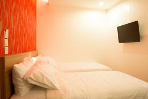 Cama o camas de una habitación en DeMira Hotel