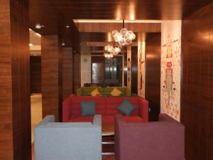 a living room filled with furniture and decor at The Belstead in Chennai