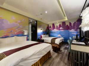 Krevet ili kreveti u jedinici u okviru objekta Stay Hotel - Taichung Zhongqing