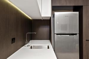 A kitchen or kitchenette at District South Yarra
