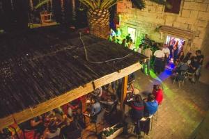an overhead view of a crowd of people at a party at Apartments Cezar in Rogoznica +83 photos