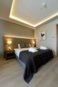 a bedroom with a large bed with two pillows at Holiday Inn Bursa - City Centre by IHG in Bursa
