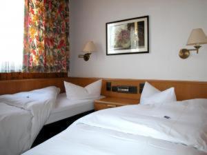 Postel nebo postele na pokoji v ubytování Hotel Gasthof Vogelsang