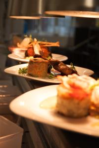 a row of plates of food on a table at The Lordleaze Hotel And Restaurant in Chard