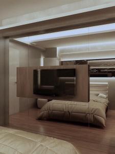a living room with a large television in a room at Grandboutique-Inn in Jakarta