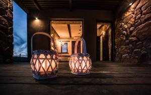 two handbags sitting on a porch of a house at Keros Blue - Luxury in Wilderness in Kalliópi