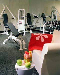 a gym with a red towel and apples on a table at Westminster Hotel in Livingston