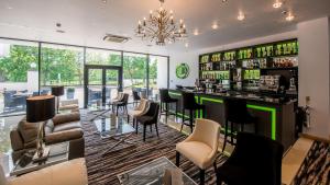 a bar in a room with chairs and tables at The Park Hotel in Barnstaple
