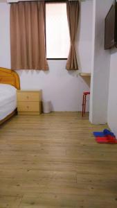 Postel nebo postele na pokoji v ubytování Chia Rong Hostel
