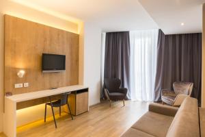 TV a/nebo společenská místnost v ubytování M Hotel