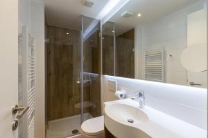 Koupelna v ubytování M Hotel