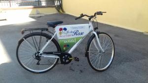 a bike is parked next to a sign at Le Tre Rose Bed & Breakfast in Casamassima
