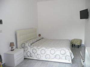 Postel nebo postele na pokoji v ubytování Garden House Ercolano
