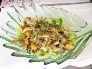 a salad in a glass plate with food on it at Hotel mon Soleil in La Gaude