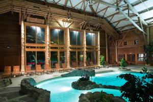 a large swimming pool in a large building at Disney Davy Crockett Ranch in Villeneuve-le-Comte