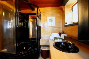 a bathroom with a sink and a shower at Villa La Foce in Castiglion Fiorentino
