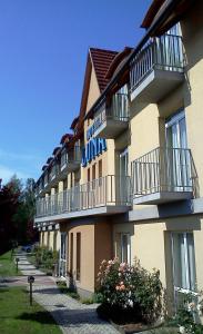 a large building with balconies on the side of it at Hotel Luna Budapest in Budapest