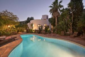 a swimming pool in front of a house at La Careza De Mijas - Adults Only in Mijas