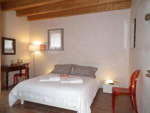 Postel nebo postele na pokoji v ubytování L'Isolo b&b e case vacanza + 37 fotografií