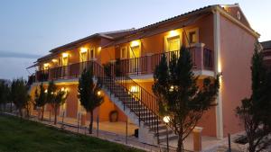 a large building with stairs and lights on it at Arillas Dream Studios in Arillas