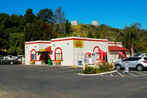 a gas station with cars parked in a parking lot at Pio Pico Camping Resort Two-Bedroom Cabin 12 in Jamul