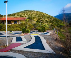 a bunch of skate ramps in front of a hill at Pio Pico Camping Resort Two-Bedroom Cabin 12 in Jamul +7 photos