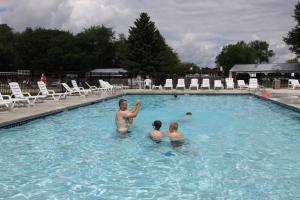 a group of people in a swimming pool at Blackhawk RV Campground Cabin 1 in Milton
